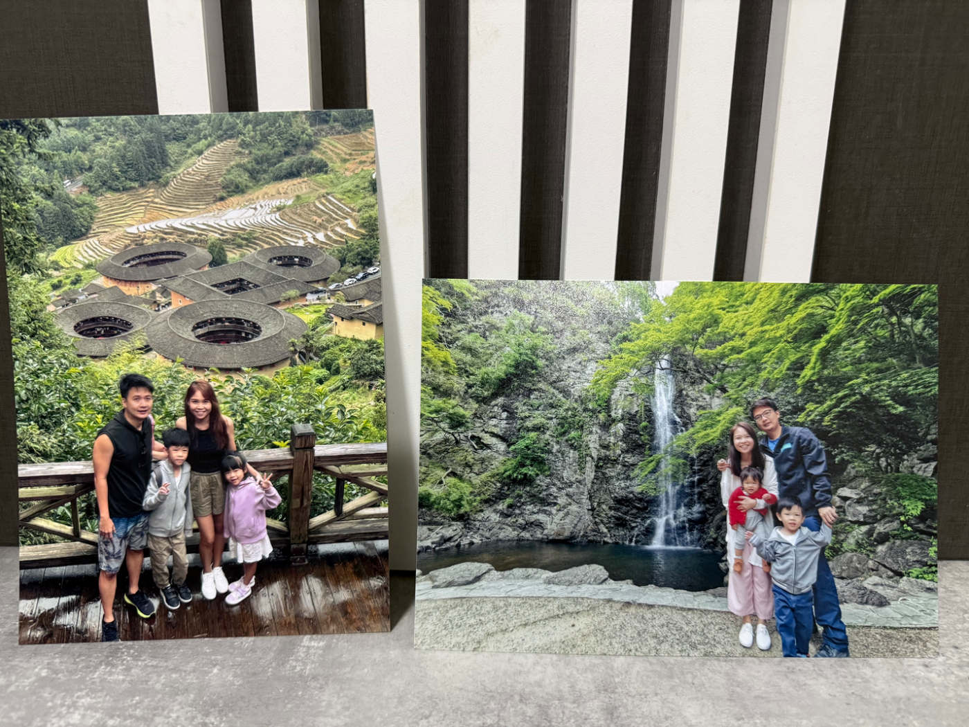 Family photo prints leaning on the studio backdrop